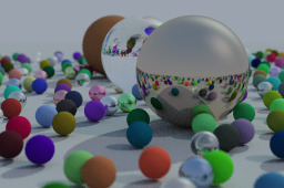 A mix of large and small spheres with different colors and reflectivities on a gray background